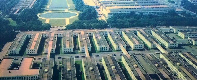 Aerial photo of the Pentagon building and its surrounding grounds and parking areas.